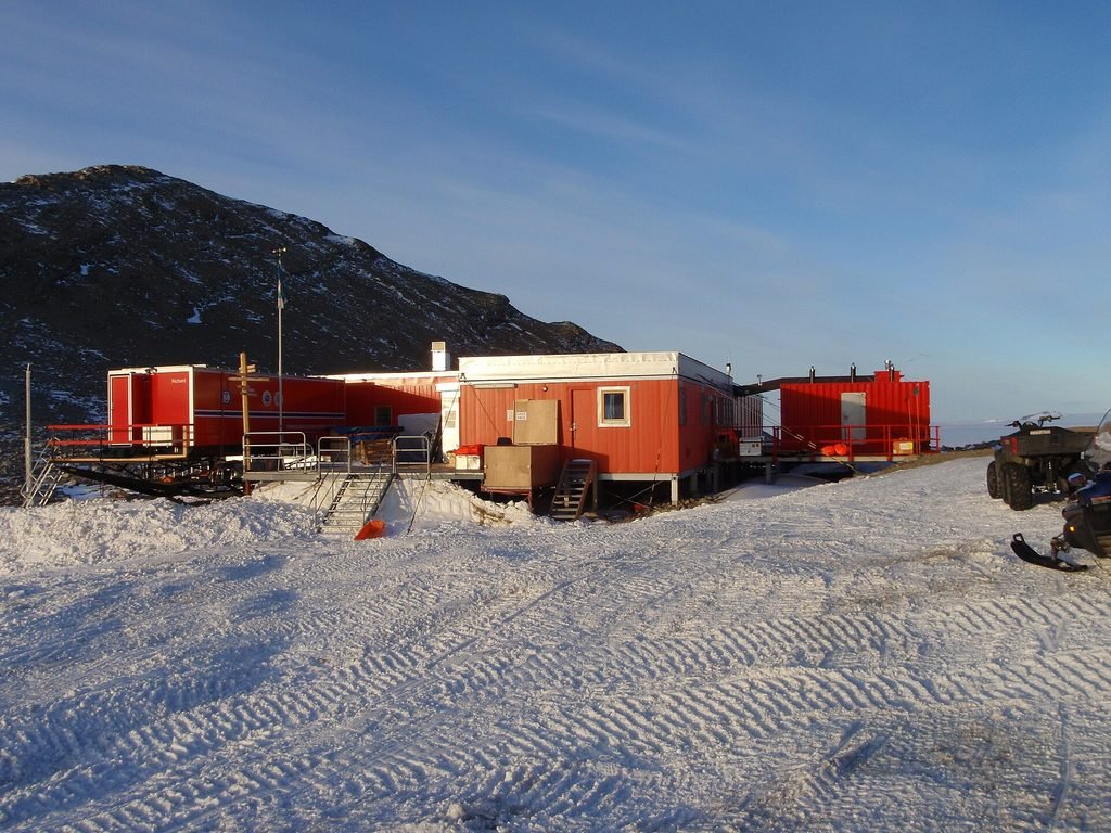 Antarctic research station surrounded by a remote polar landscape, reflecting the isolated setting of The Thing (1982).